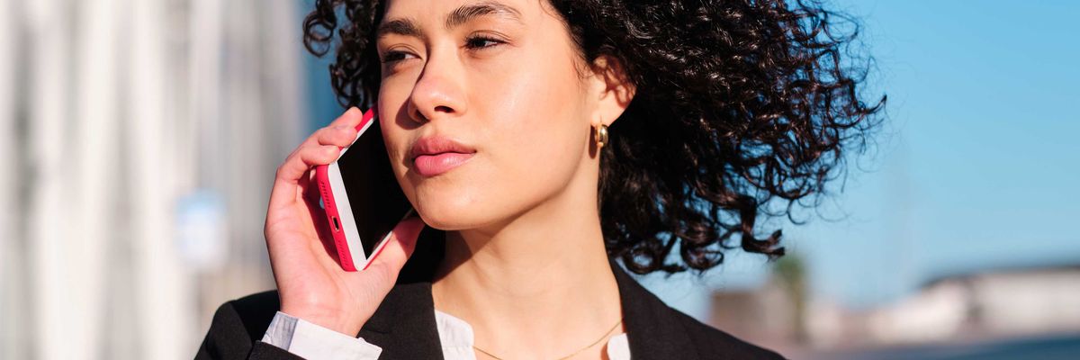 A woman speaks on the phone