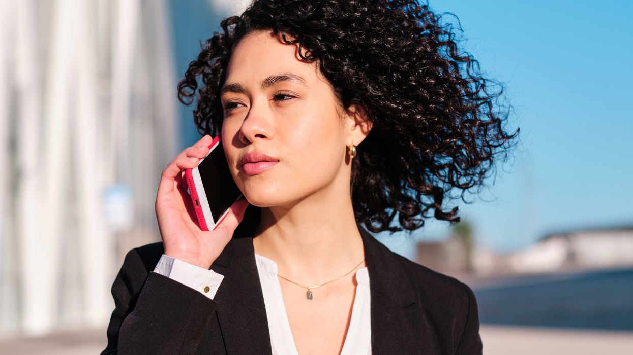 A woman speaks on the phone