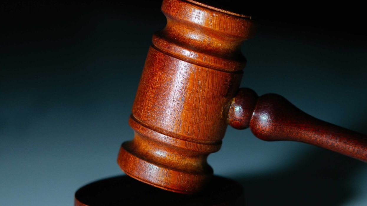 a wooden judge's hammer on top of a table.