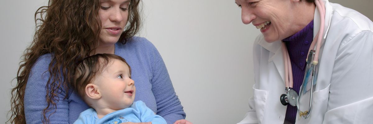 a young child being vaccinated by a doctor