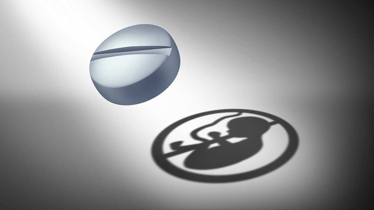 Abortion Pill Concept or oral contraceptive medication as an anti reproductive medicine to prevent pregnancy or birth control or as a social issue for reproduction justice as a 3D illustration.