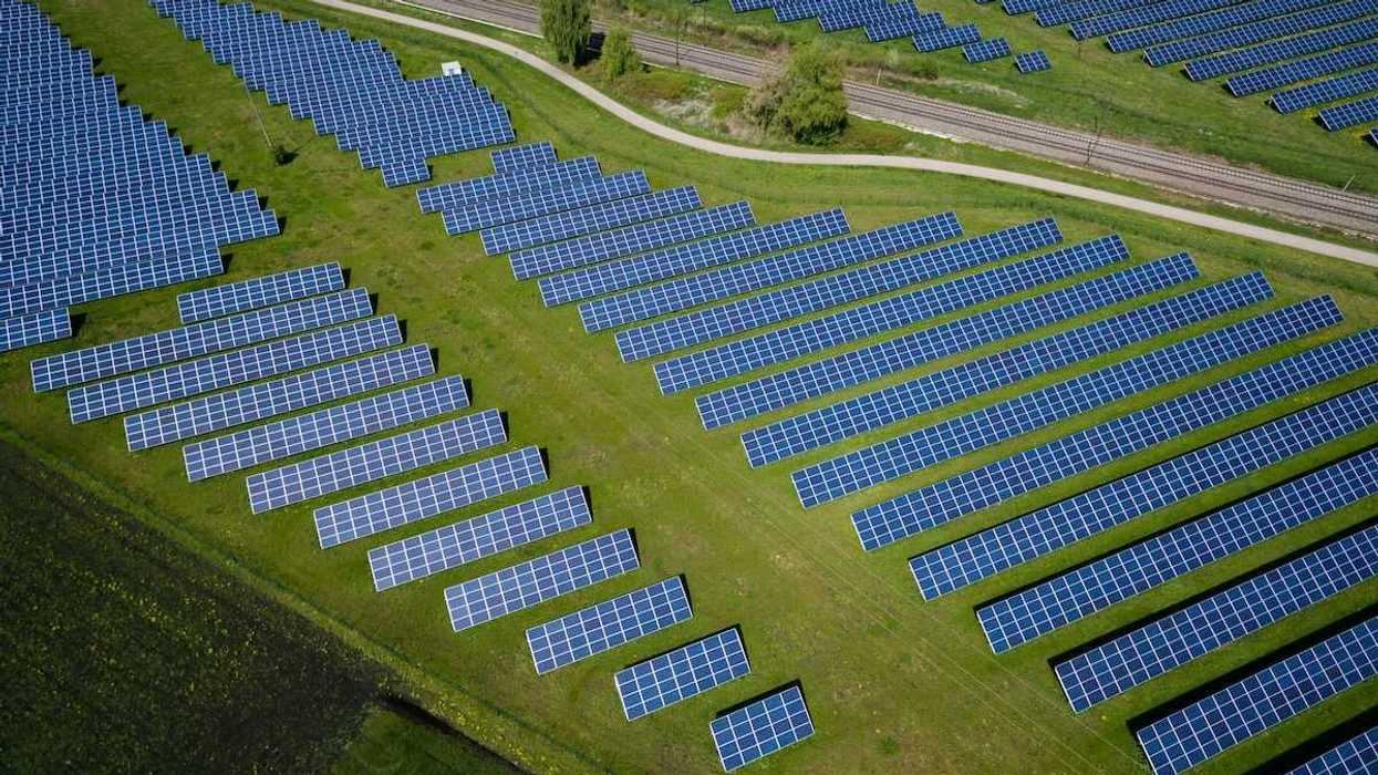 Aerial drone photo of a solar installation in rural countryside
