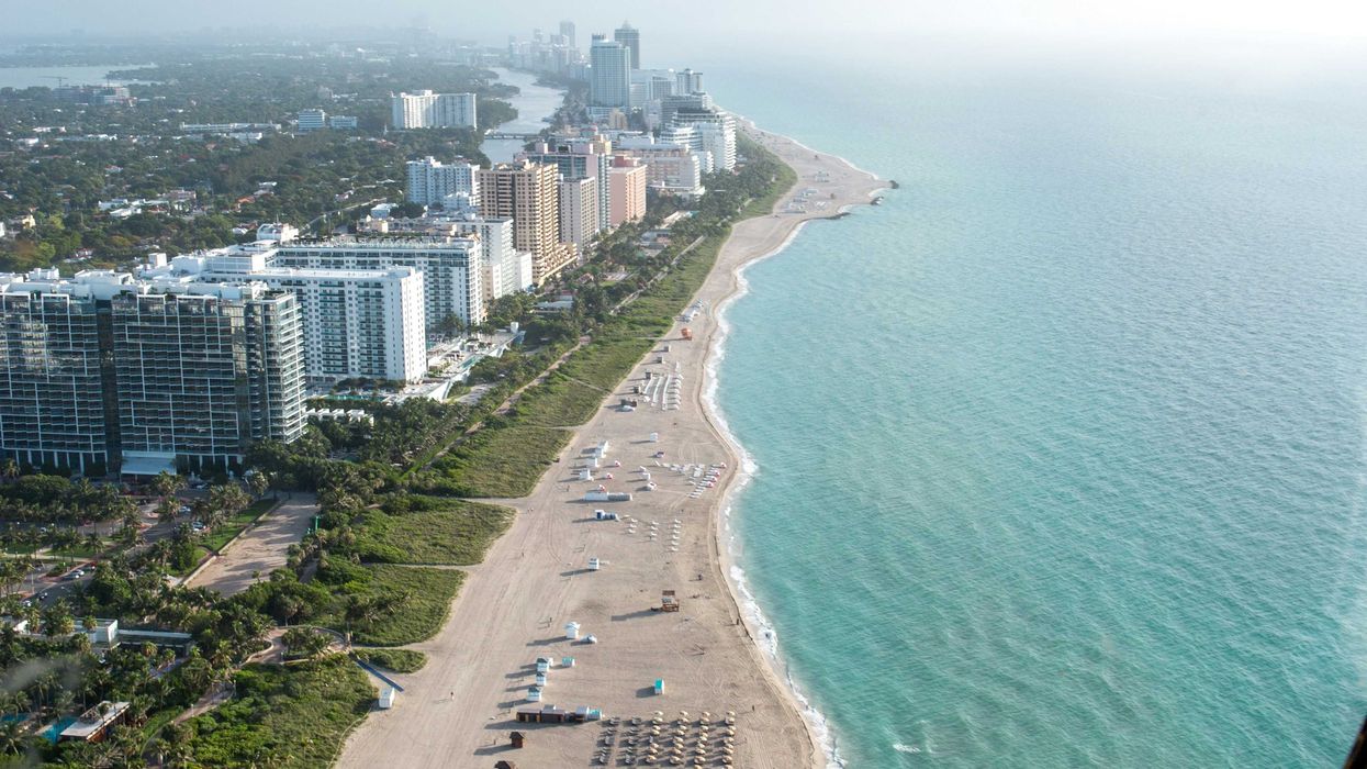 aerial photograph of seashore and buildings.