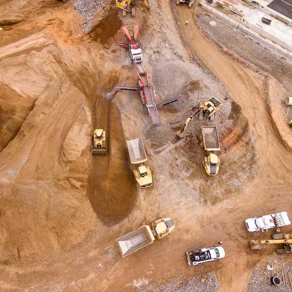 aerial photography of mining dump trucks.