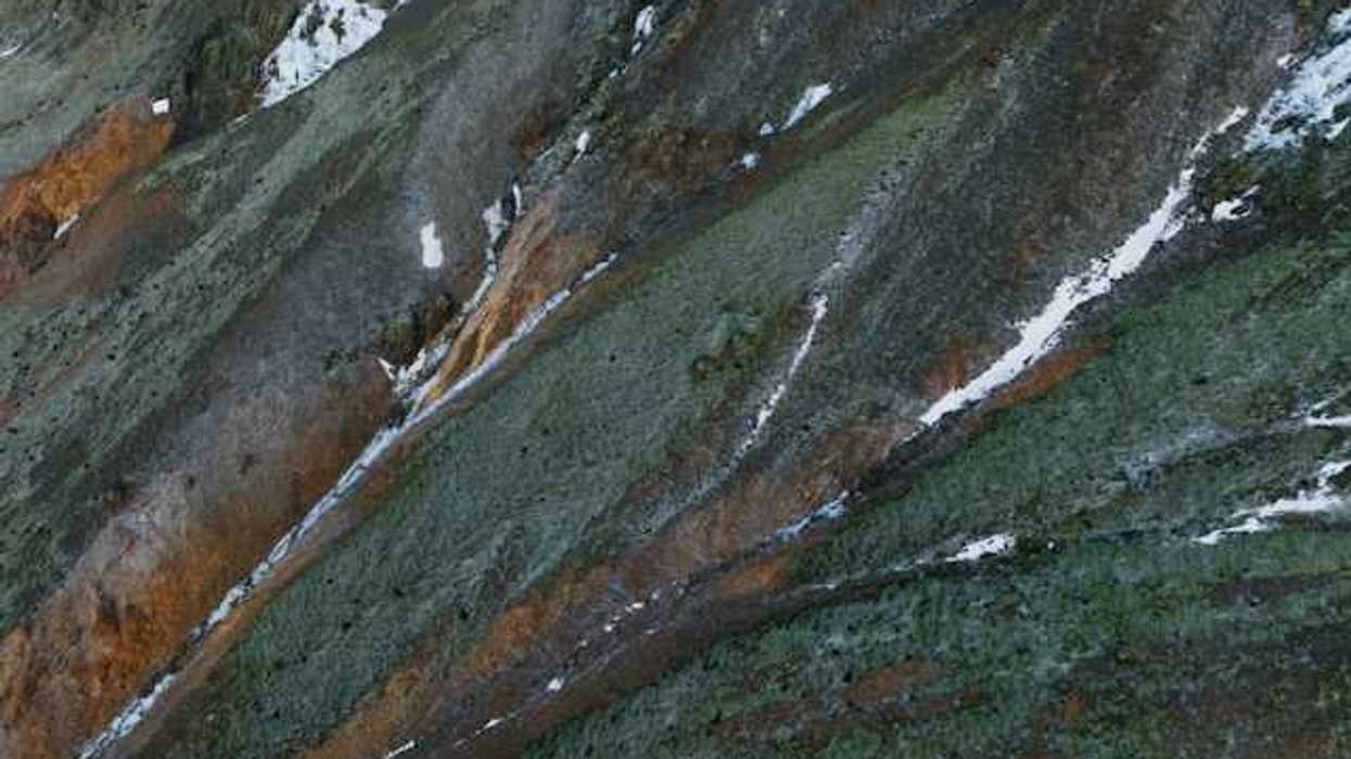 Aerial view of a mountain with snow on it