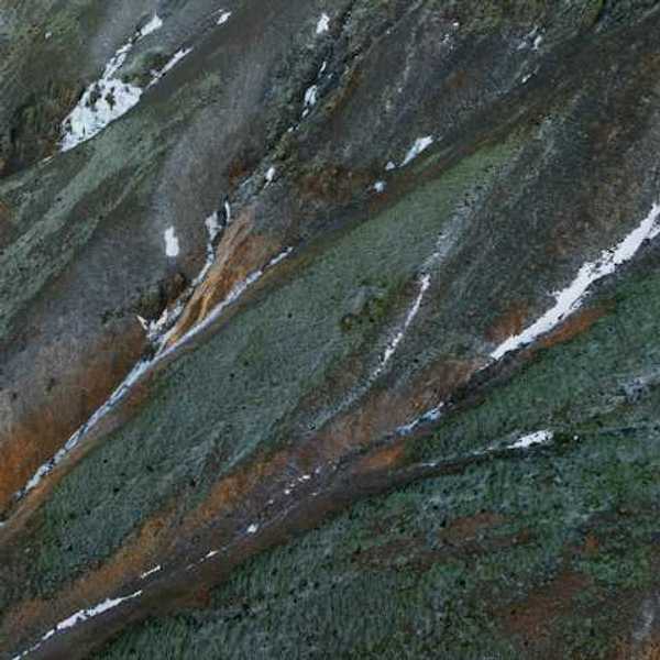 Aerial view of a mountain with snow on it