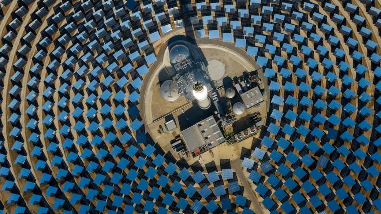 aerial view of a solar power generating facility with panels deployed in a circular configuration.