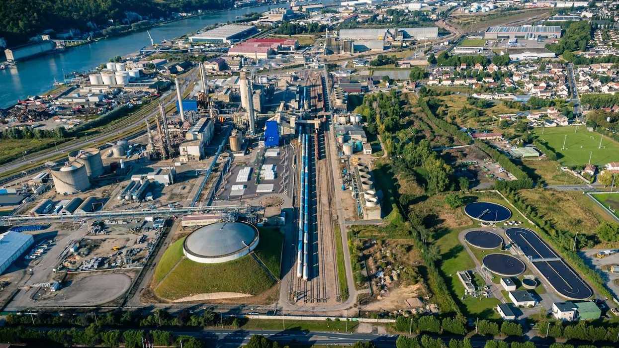 Aerial view of an industrial zone adjacent to housing