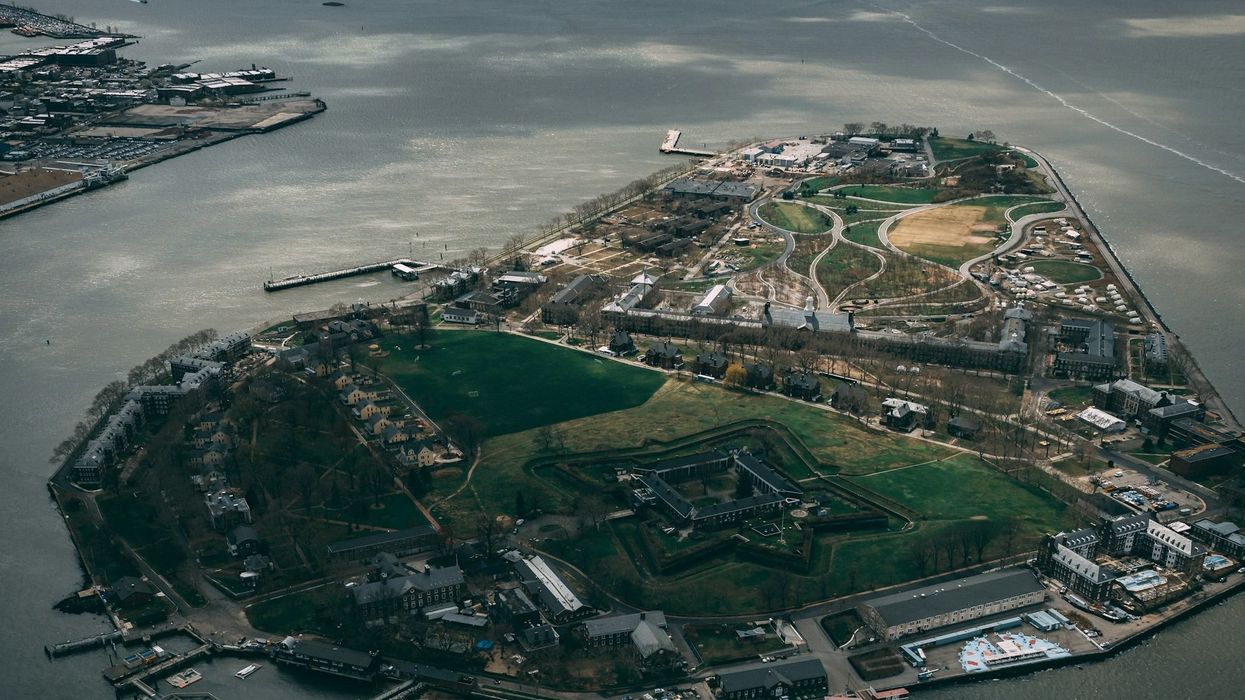 aerial view of Governors Island, New York Harbor on a partly cloudy day.