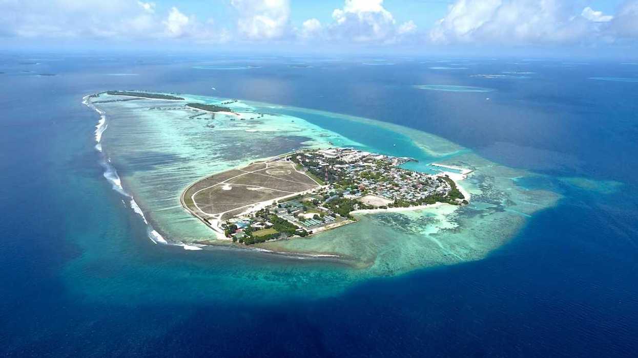 Aerial view of Himmafushi island in the Maldives exemplifying sea level vulnerability