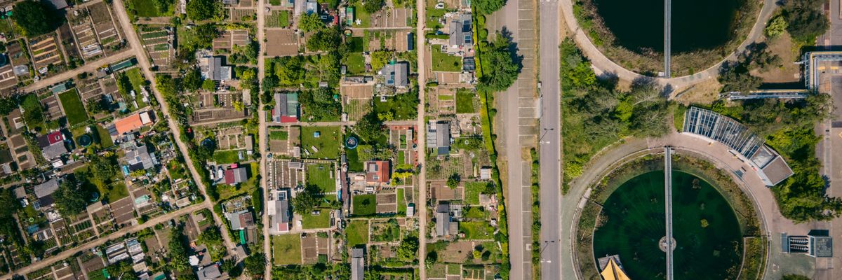 aerial view of water treatment plants next to a city