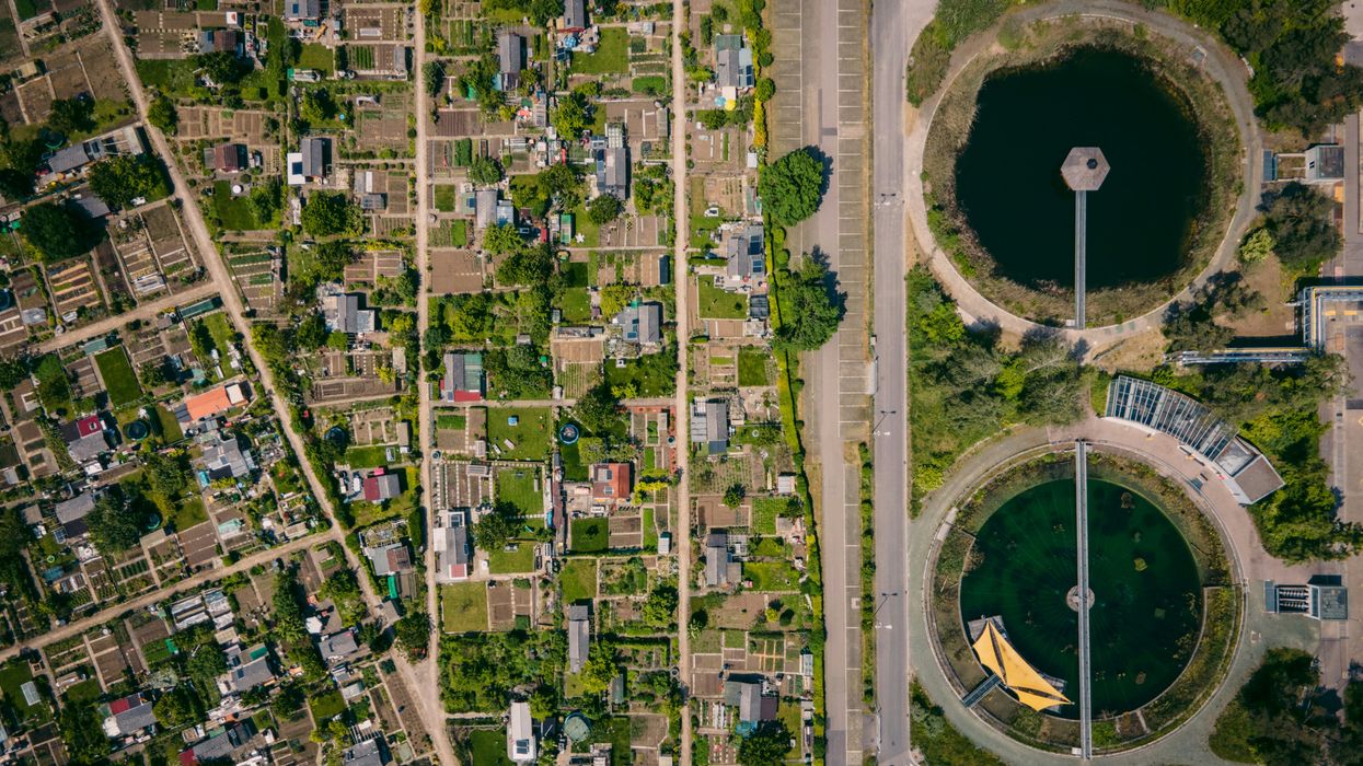 aerial view of water treatment plants next to a city