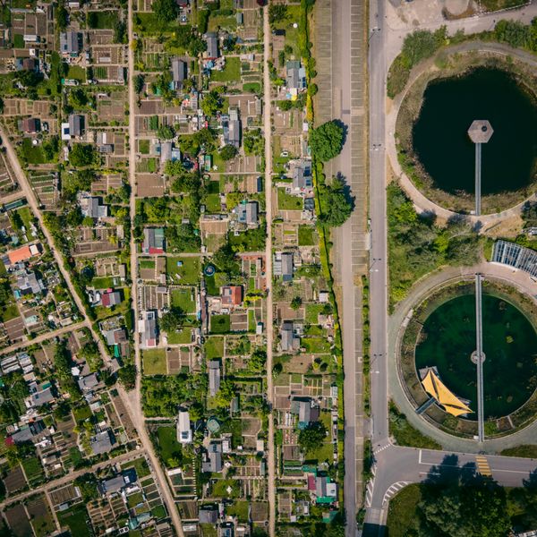 aerial view of water treatment plants next to a city