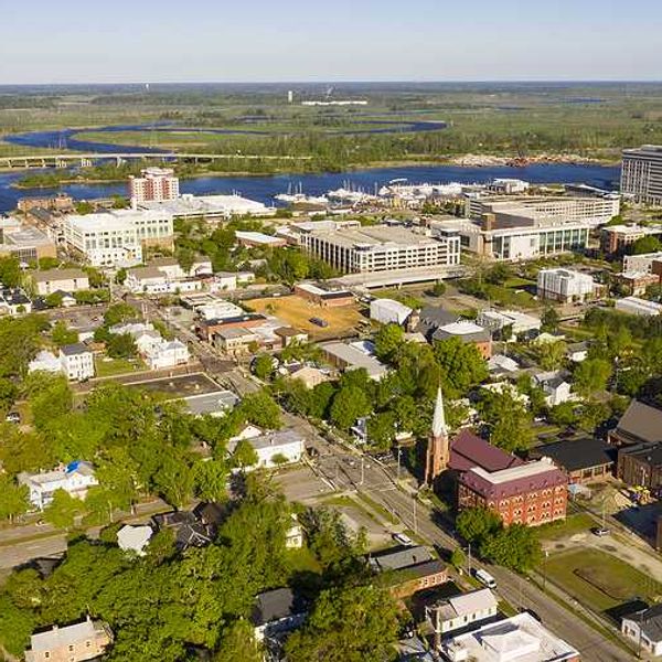 Aerial view of Wilmington NC building and river