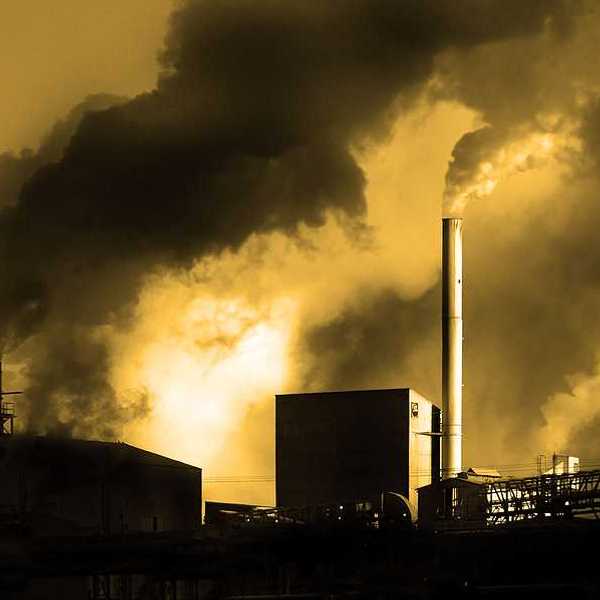 Air pollution coming from factory smoke stacks