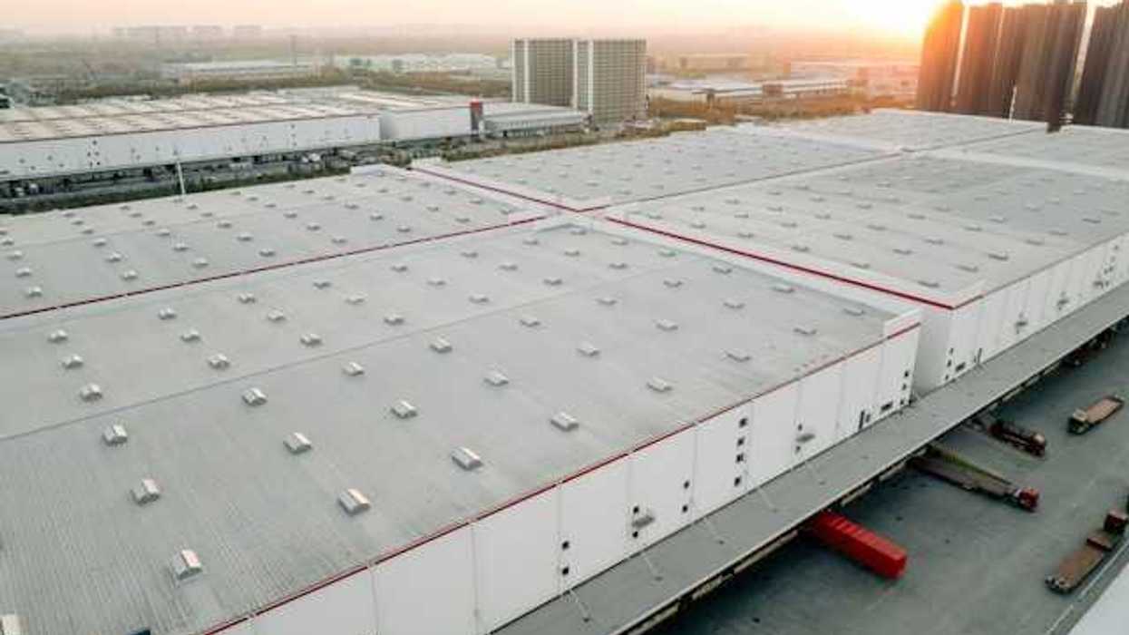 An aerial view of a a series of warehouses in an urban location