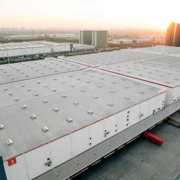 An aerial view of a a series of warehouses in an urban location