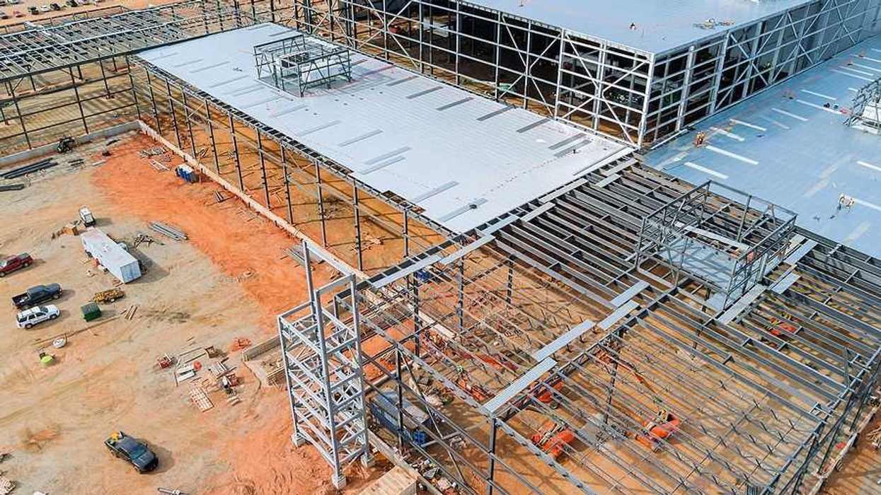 An aerial view of a large building under construction