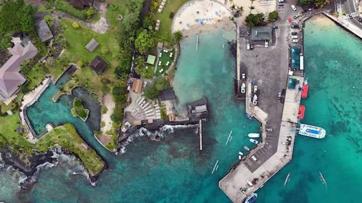 An aerial view of a residential coastal area in Hawaii with inlets and a marina