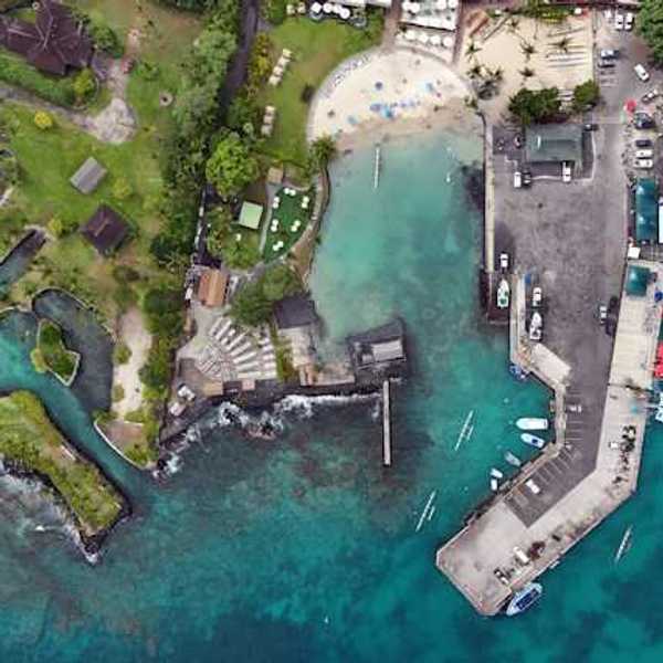 An aerial view of a residential coastal area in Hawaii with inlets and a marina