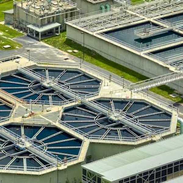 An aerial view of a water treatment system with tanks of water and machinery