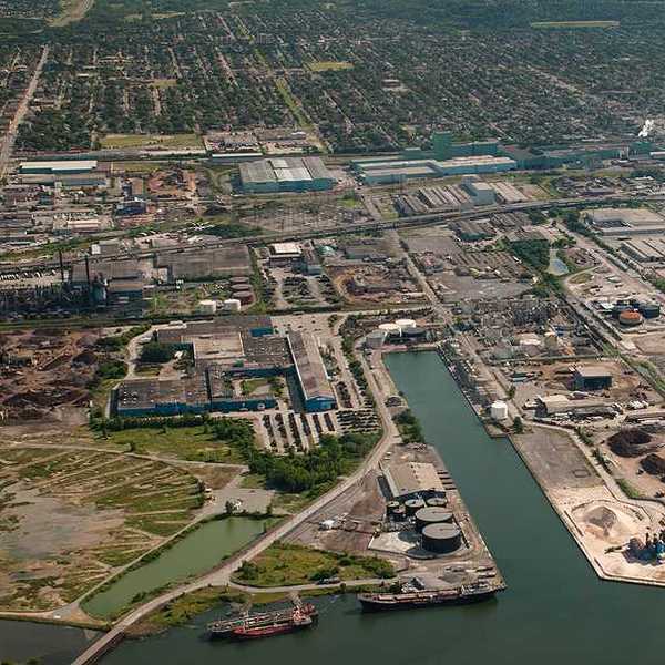 An aerial view of an industrial area along a harbor