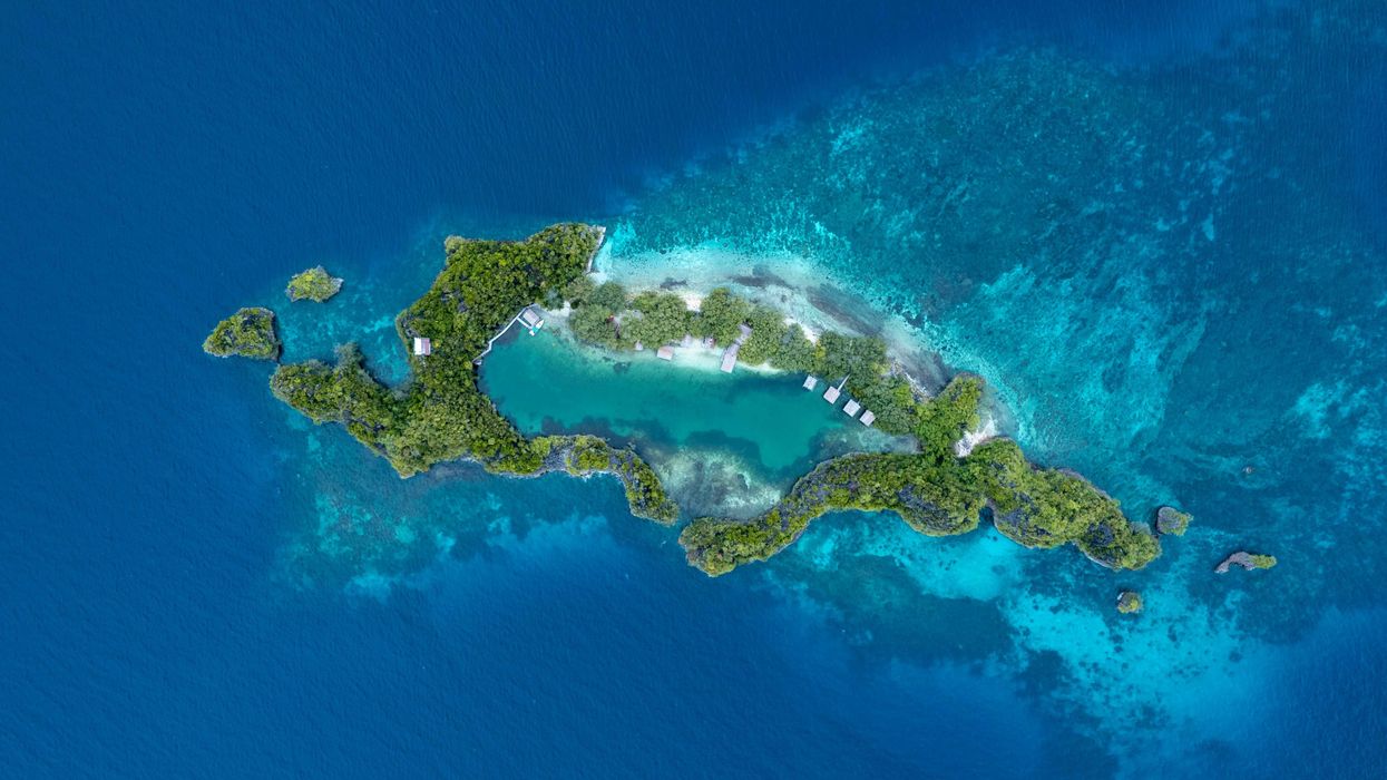 an aerial view of an island in the middle of the ocean
