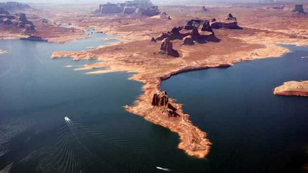 An aerial view of Lake Powell with boats navigating through the water