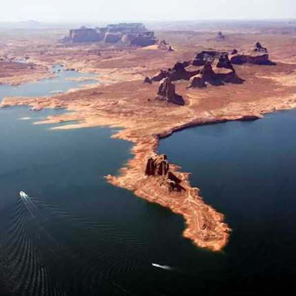 An aerial view of Lake Powell with boats navigating through the water