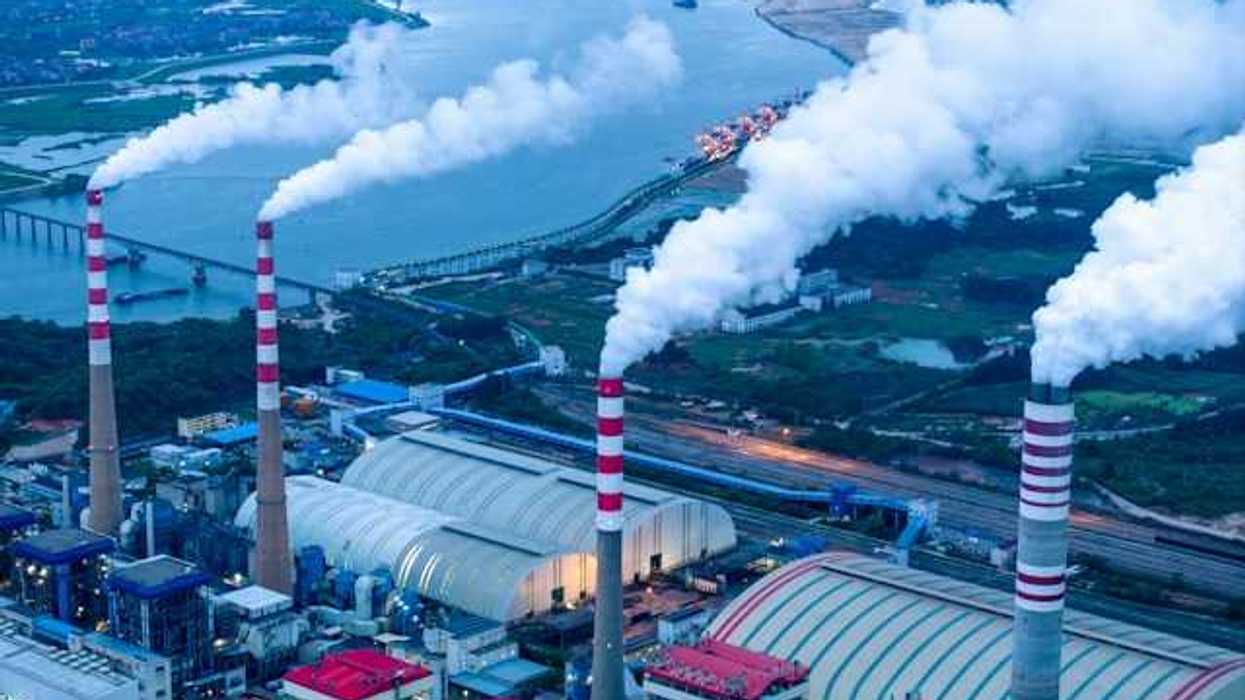 An aerial view of pollution spewing from smokestacks