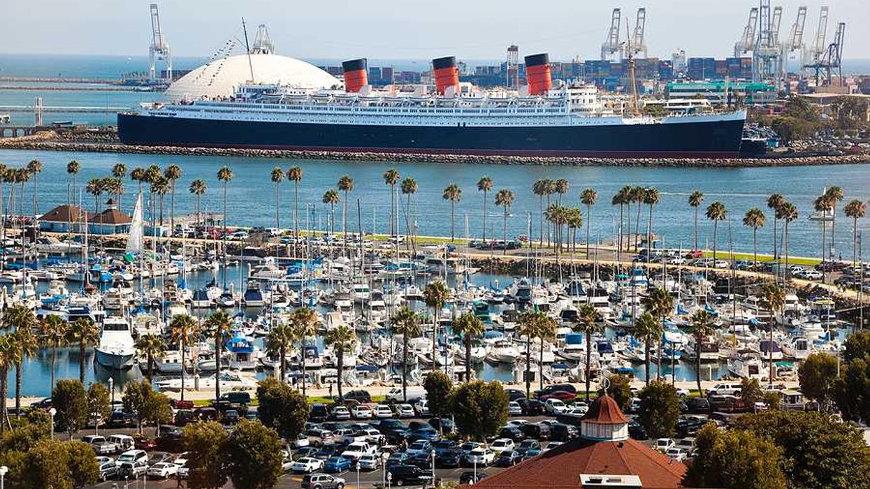 An aerial view of the long beach port with a cruise ship in the background