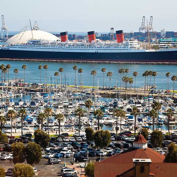An aerial view of the long beach port with a cruise ship in the background