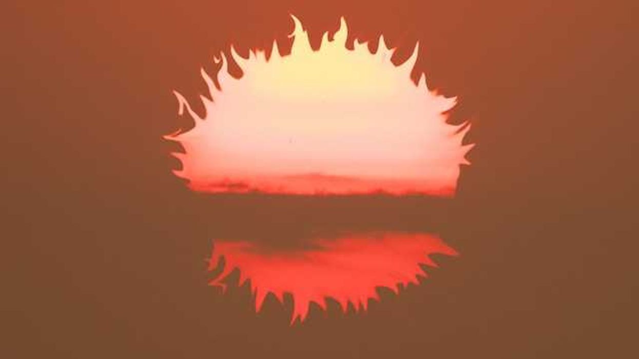 An illustration of a burning sun falling below the horizon