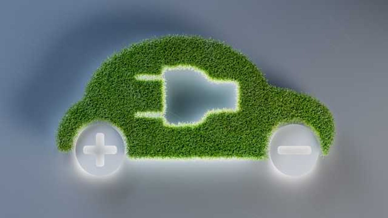 An illustration of an electric vehicle with green grass for the body of the car
