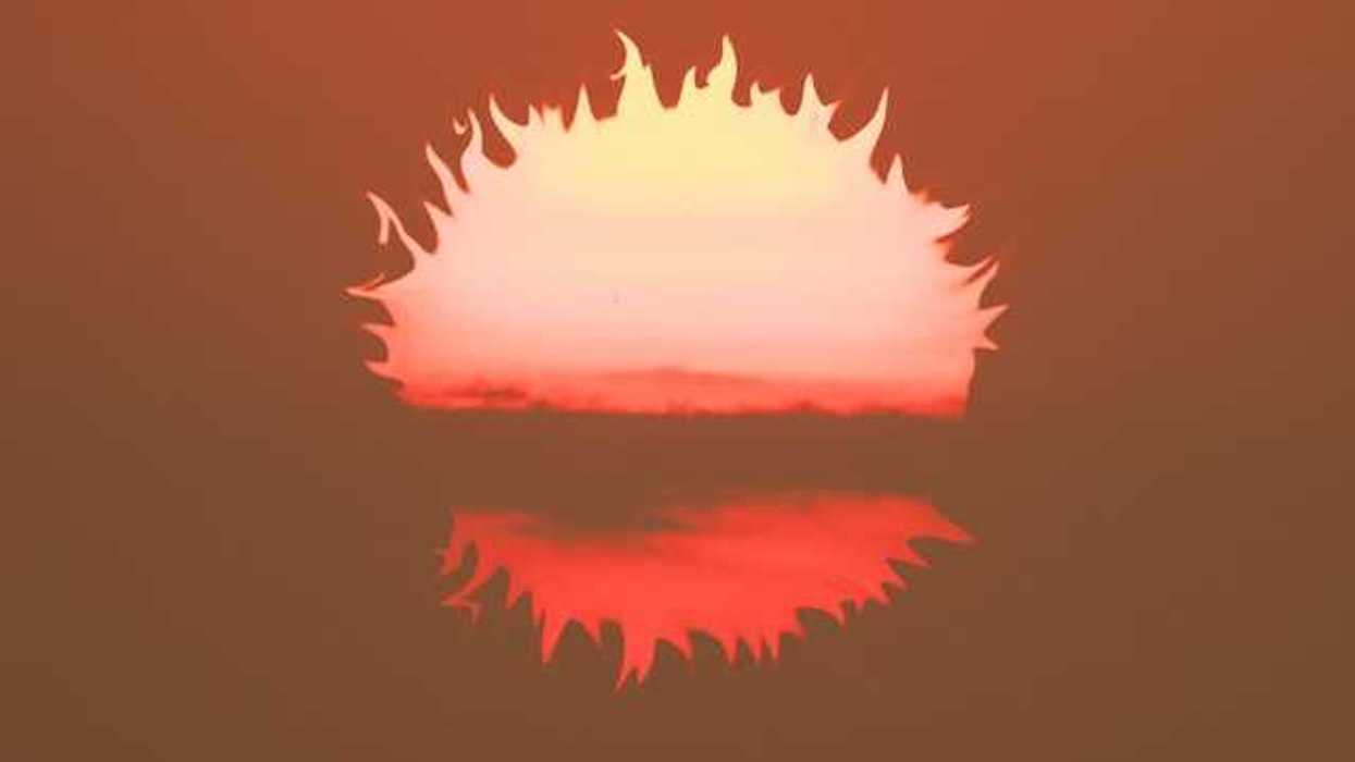 An illustration of the setting sun in front of an orange sky
