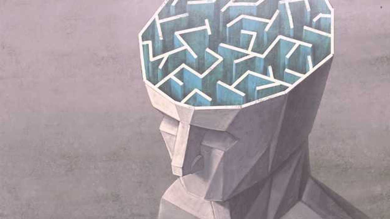 An illustration of the top of a human head with the brain exposed showing a maze