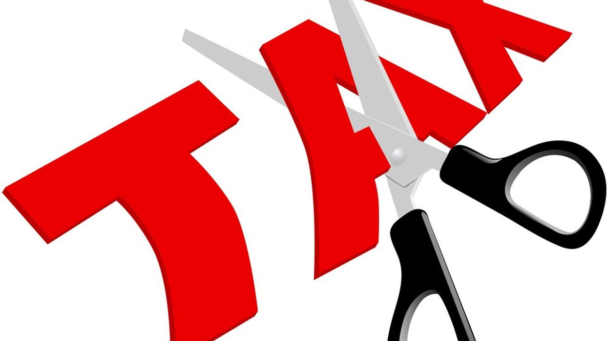 An illustration of the word TAX in red with scissors cutting the 'A' in half.