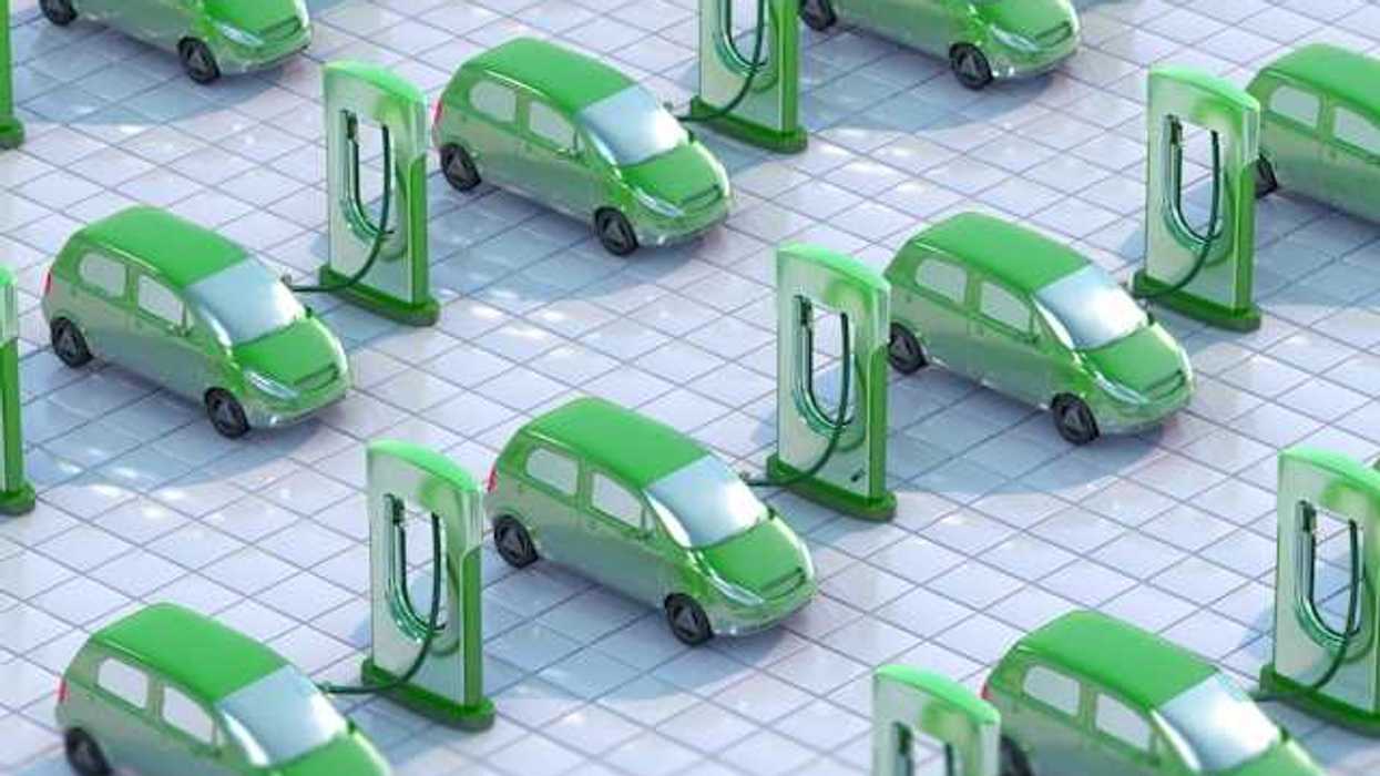 An illustration showing green electric vehicles hooked up to EV charging ports