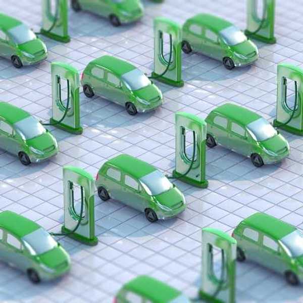 An illustration showing green electric vehicles hooked up to EV charging ports
