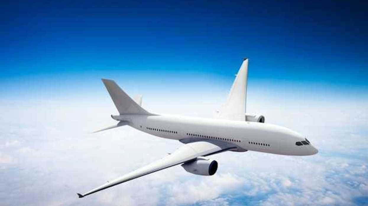 An image of an airplane flying above the clouds
