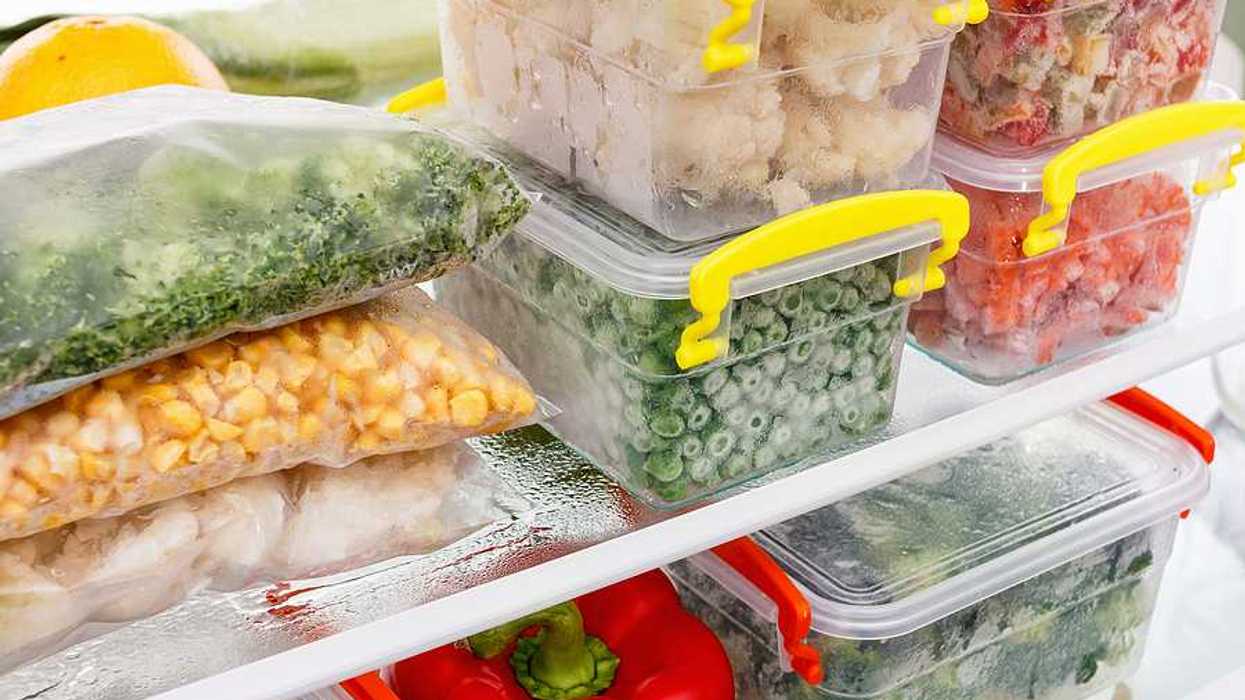 An image of frozen food in tupperware in a freezer