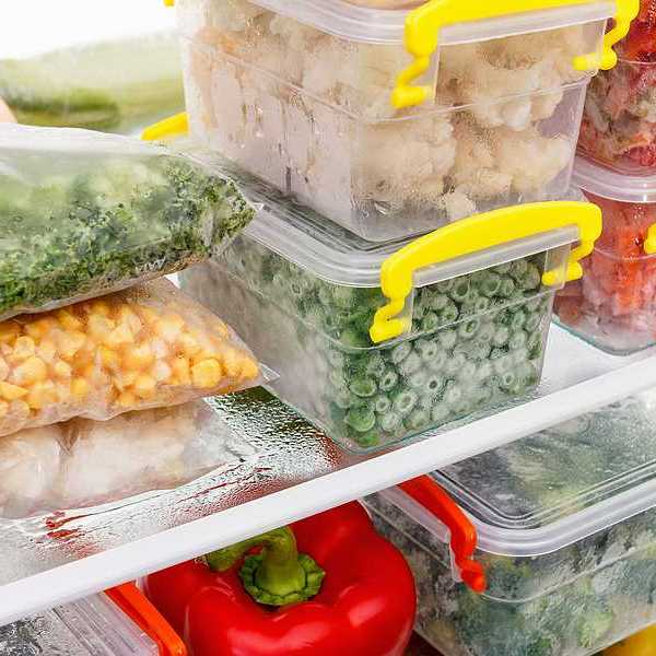 An image of frozen food in tupperware in a freezer