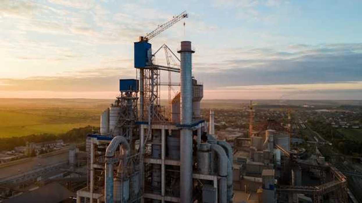 An industrial plant viewed from above against a blue sky