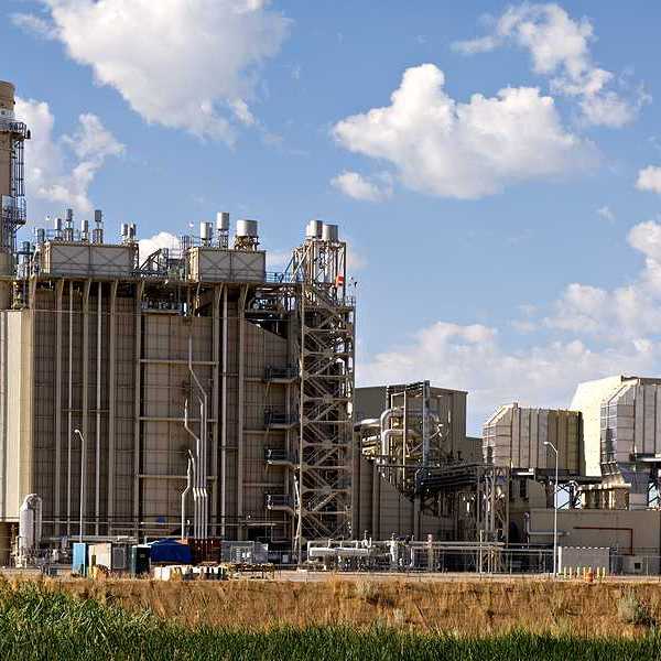An industrial plant with fields in the foreground