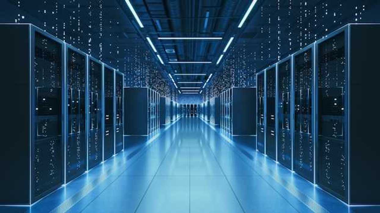 An interior view of a data center with servers stretching into the distance