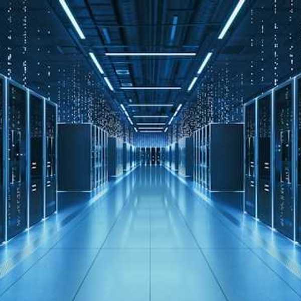 An interior view of a data center with servers stretching into the distance