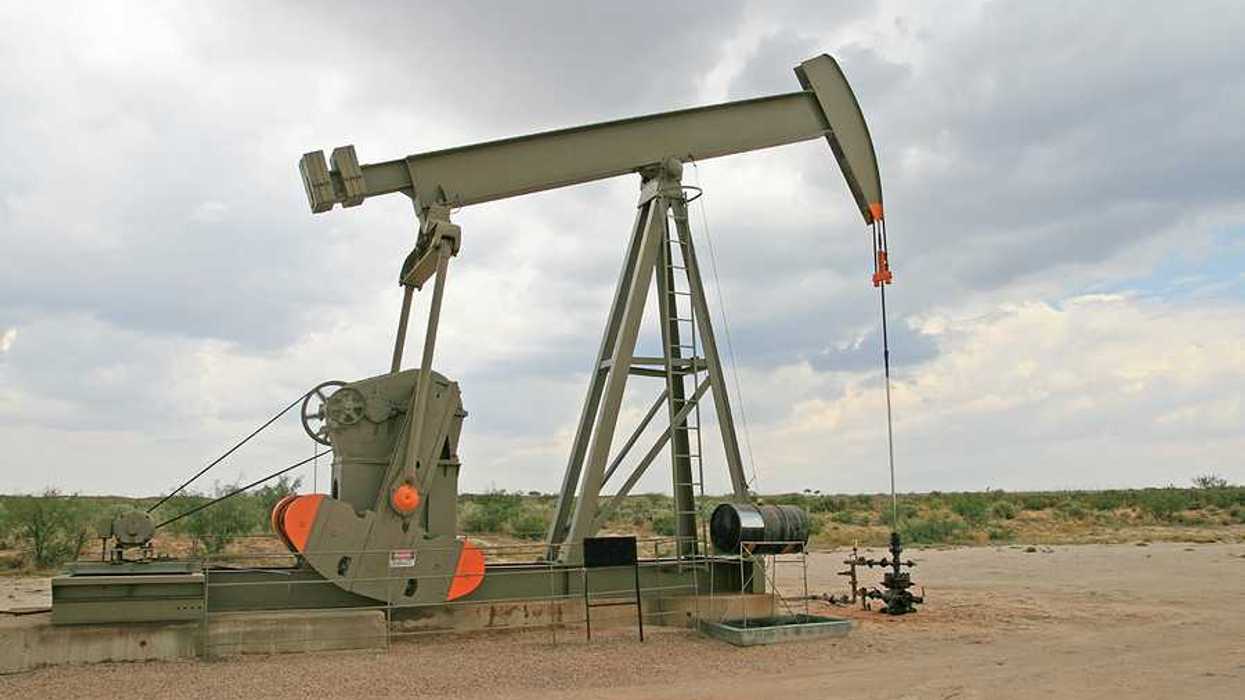 An oil pump jack in a dry field