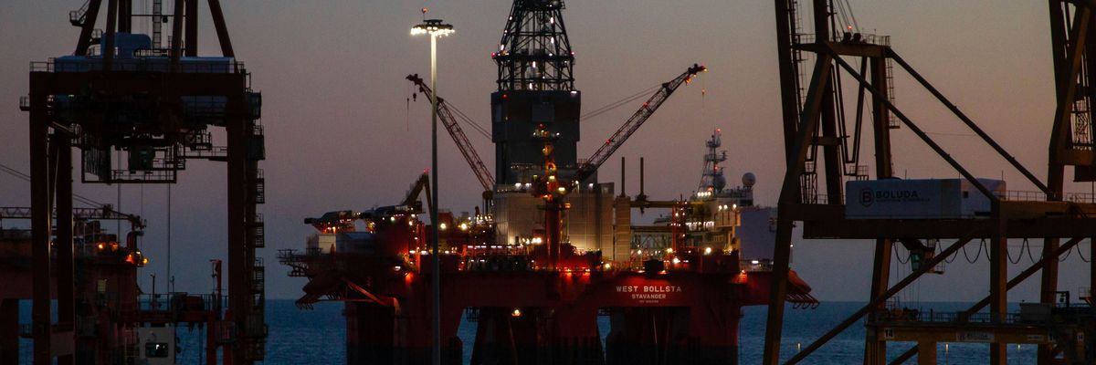 An oil rig at dusk