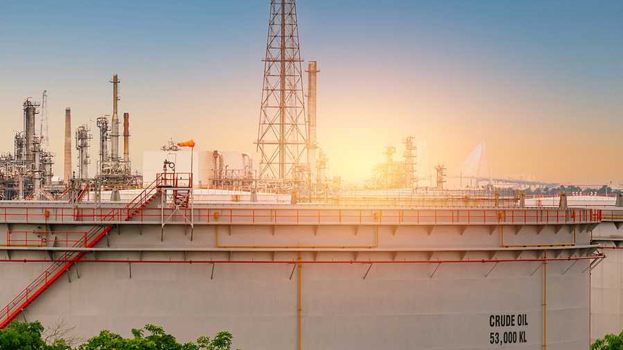 An oil tank with the sunset in the background