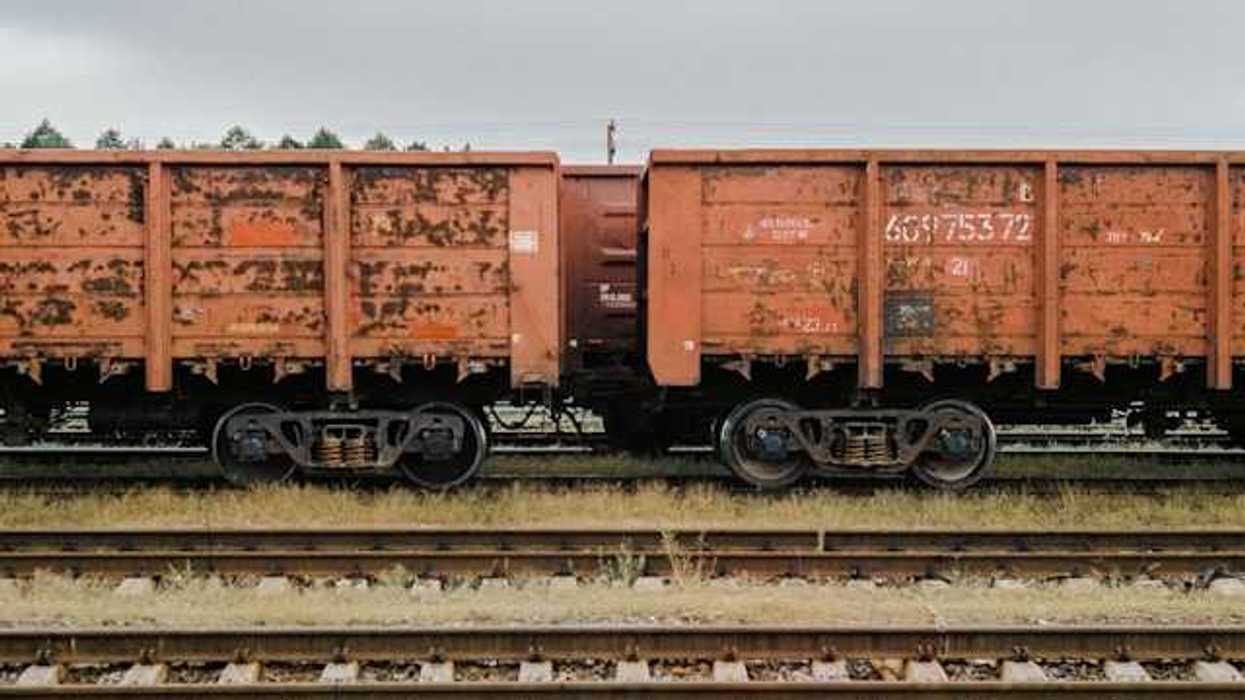 An old freight train on railroad tracks